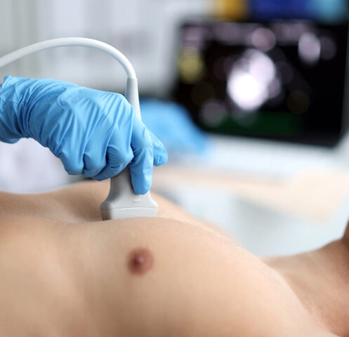 Doctor,Performs,Chest,Ultrasound,On,Man,In,Hospital,Closeup Doctor performs chest ultrasound on man in hospital closeup